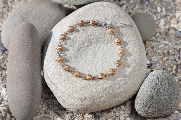 Tiny periwinkle snail tennis bracelet